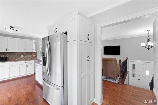 8316 D Rd, Waterloo, IL 62298 - kitchen with stainless steel fridge with ice dispenser, crown molding, white cabinetry, dark wood-style floors, and tasteful backsplash