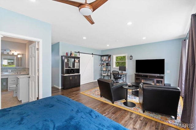 8316 D Rd, Waterloo, IL 62298 - living room with a barn door, wood finished floors, recessed lighting, baseboards, and ceiling fan