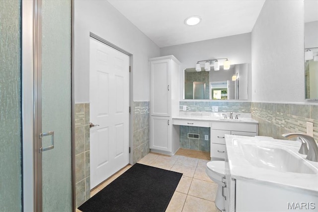 8316 D Rd, Waterloo, IL 62298 - full bath featuring tile walls, tile patterned flooring, wainscoting, a stall shower, and toilet
