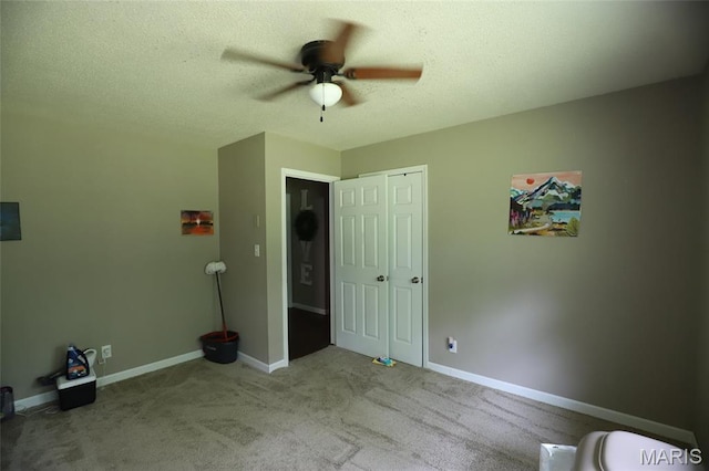 1507 Vine St, Poplar Bluff, MO 63901 - unfurnished bedroom with carpet floors, baseboards, a ceiling fan, a textured ceiling, and a closet