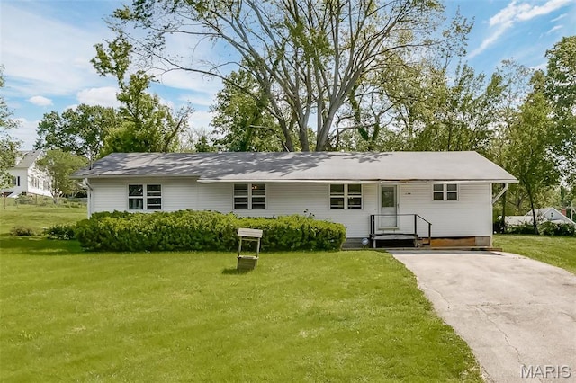 128 Cumberland Ave, Maryland Heights, MO 63043 - rear view of property with a lawn and driveway