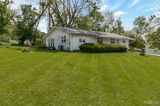 128 Cumberland Ave, Maryland Heights, MO 63043 - back of property with a lawn and central AC unit