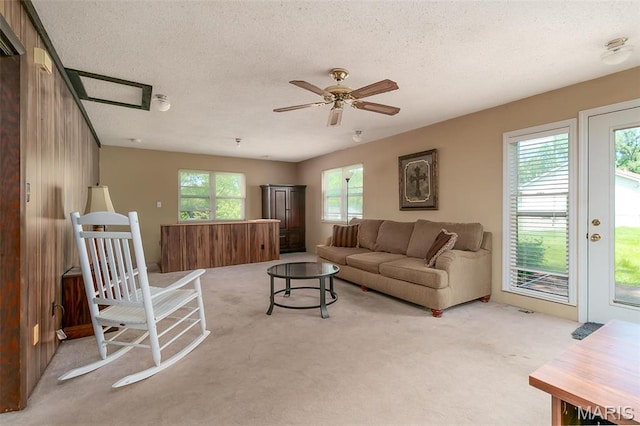 128 Cumberland Ave, Maryland Heights, MO 63043 - carpeted living area featuring a textured ceiling and a ceiling fan