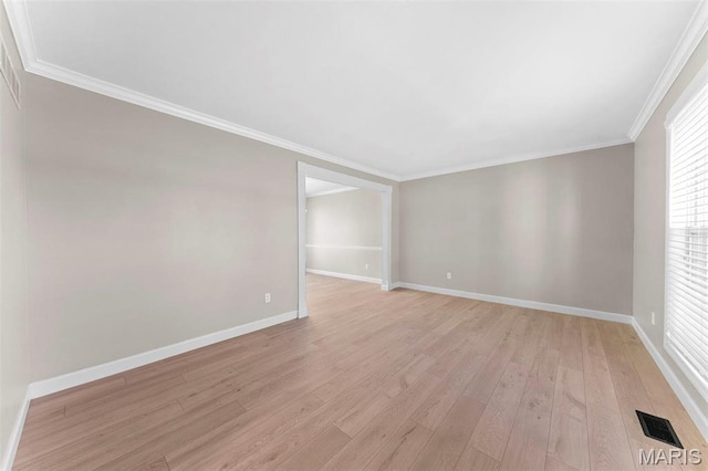 3009 Country Knoll Dr, Saint Charles, MO 63303 - spare room featuring light wood-style floors, baseboards, and ornamental molding