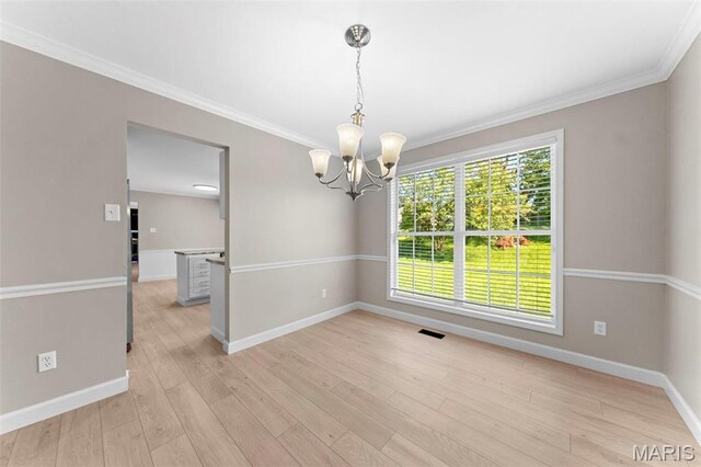 3009 Country Knoll Dr, Saint Charles, MO 63303 - unfurnished dining area featuring a chandelier, baseboards, light wood finished floors, and crown molding