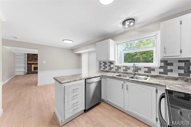 3009 Country Knoll Dr, Saint Charles, MO 63303 - kitchen featuring stainless steel dishwasher, a sink, black range with electric cooktop, a peninsula, and decorative backsplash