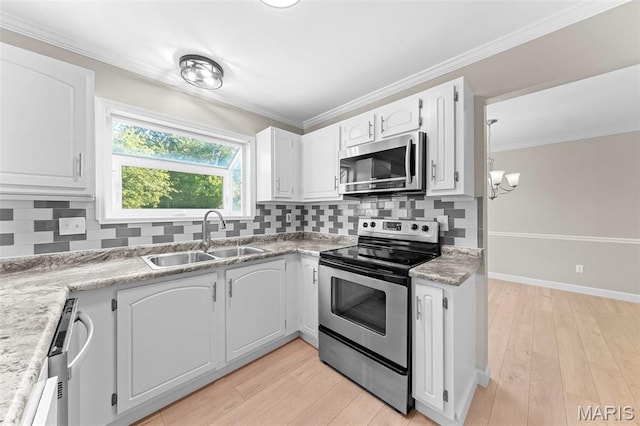3009 Country Knoll Dr, Saint Charles, MO 63303 - kitchen with stainless steel appliances, a sink, white cabinets, a chandelier, and tasteful backsplash
