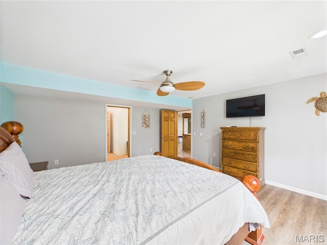 109 Locust Ct, Saint Robert, MO 65584 - bedroom with wood finished floors, baseboards, and a ceiling fan