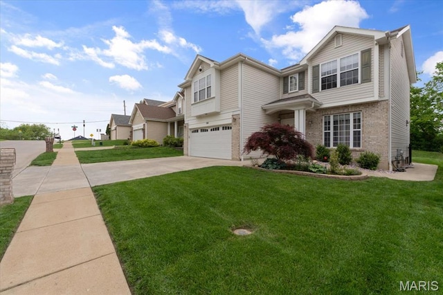 view of front of home with brick siding, a garage, driveway, and a front lawn