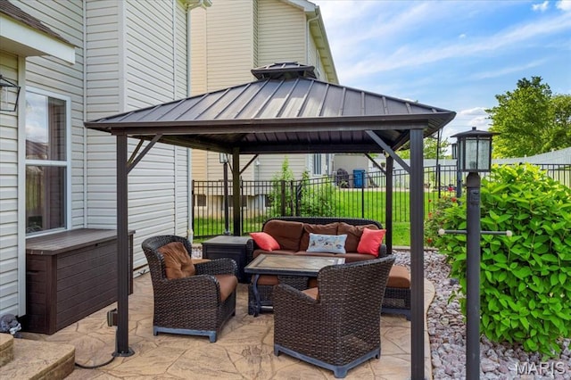 view of patio / terrace featuring an outdoor hangout area, a gazebo, and fence