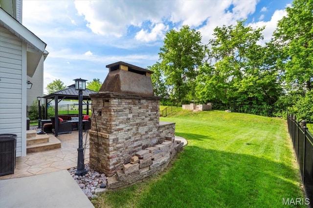 view of yard featuring a gazebo, a patio area, and an outdoor living space