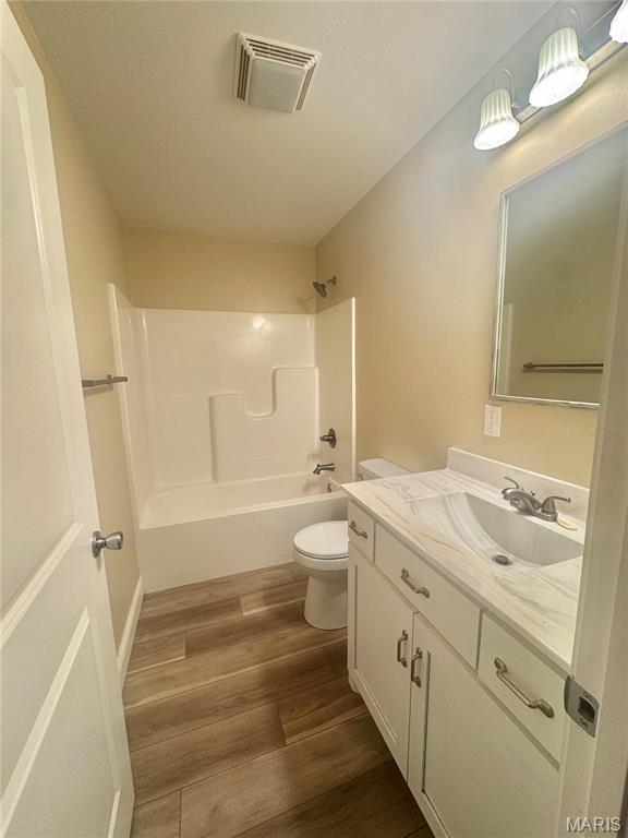 400 E Deerwood Drive 400 & 402, Jackson, MO 63755 - bathroom with vanity, bathtub / shower combination, and wood finished floors