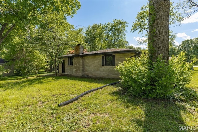 701 Hillsboro Rd, Farmington, MO 63640 - view of side of home with a chimney and a lawn