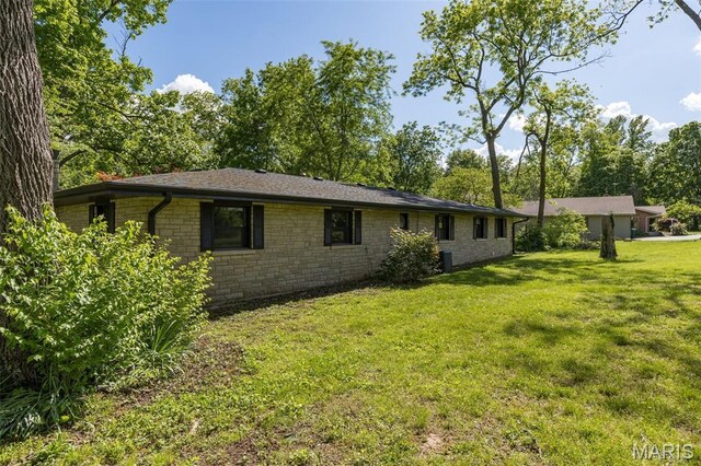 701 Hillsboro Rd, Farmington, MO 63640 - view of side of home featuring stone siding and a lawn