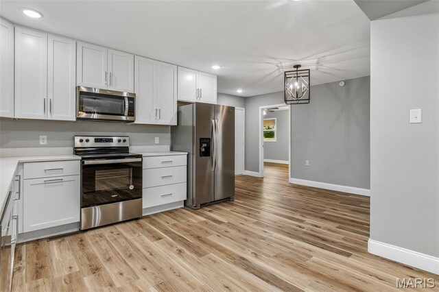 701 Hillsboro Rd, Farmington, MO 63640 - kitchen with appliances with stainless steel finishes, baseboards, light countertops, white cabinets, and recessed lighting