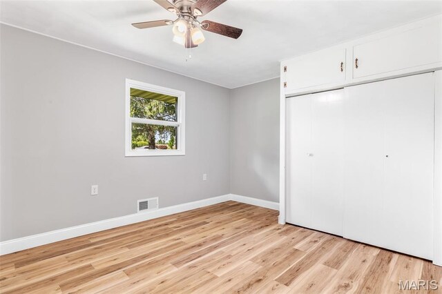 701 Hillsboro Rd, Farmington, MO 63640 - unfurnished bedroom featuring light wood-style floors, a closet, baseboards, and a ceiling fan