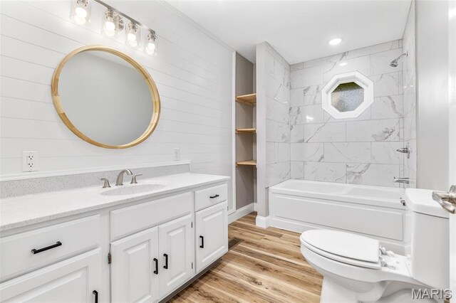 701 Hillsboro Rd, Farmington, MO 63640 - full bath with vanity, toilet, wood finished floors, wood walls, and bathing tub / shower combination
