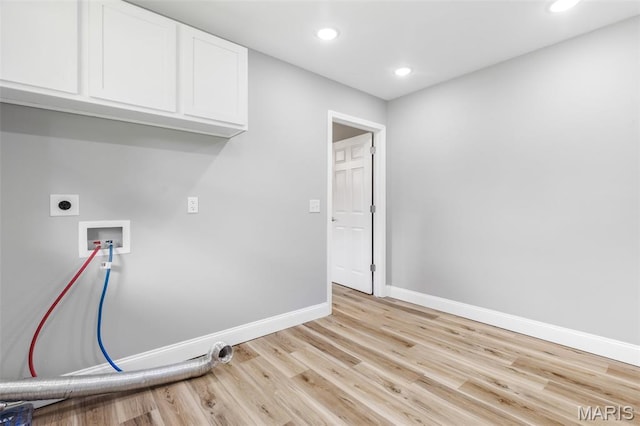 701 Hillsboro Rd, Farmington, MO 63640 - laundry room with cabinet space, washer hookup, baseboards, light wood-type flooring, and hookup for an electric dryer