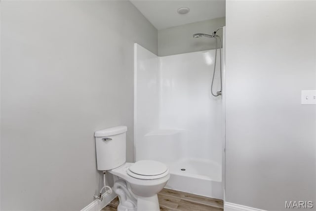 701 Hillsboro Rd, Farmington, MO 63640 - bathroom with wood finished floors, baseboards, and a shower