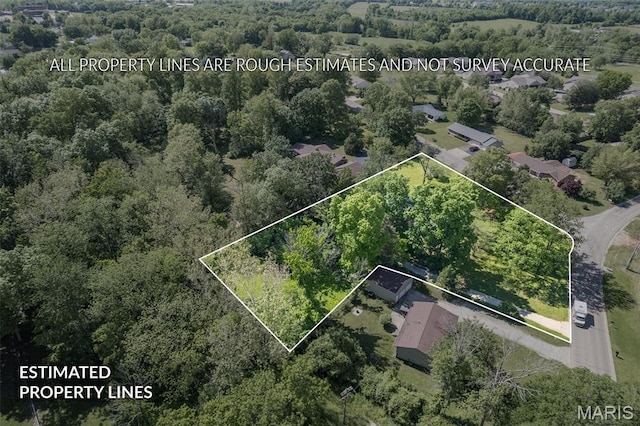 701 Hillsboro Rd, Farmington, MO 63640 - aerial view of property and surrounding area with property boundaries highlighted and a heavily wooded area