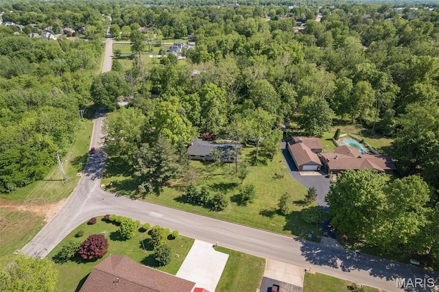 701 Hillsboro Rd, Farmington, MO 63640 - aerial view of property and surrounding area with a heavily wooded area