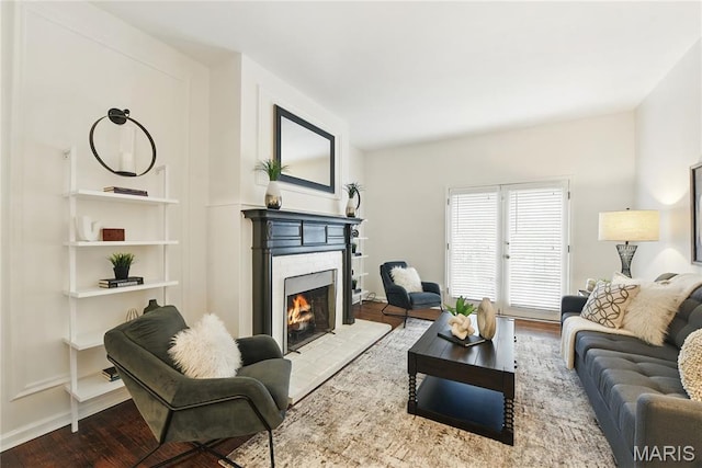 10 N Taylor Ave # 1S, Saint Louis, MO 63108 - living area with a lit fireplace and wood finished floors
