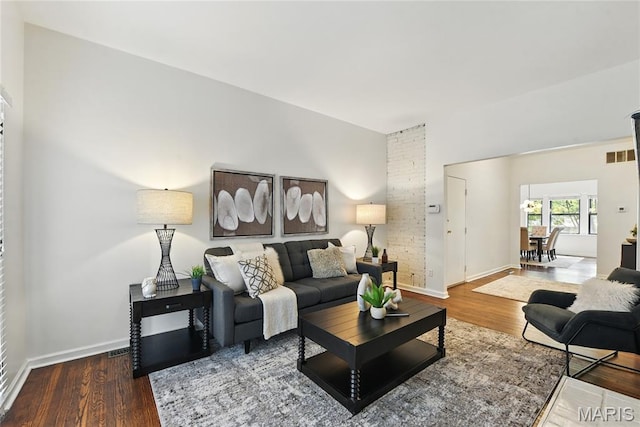 10 N Taylor Ave # 1S, Saint Louis, MO 63108 - living room with wood finished floors and baseboards