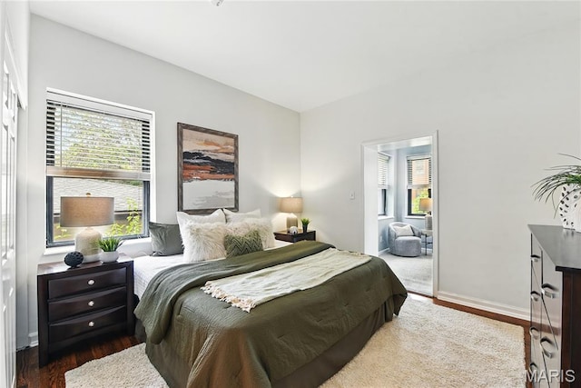10 N Taylor Ave # 1S, Saint Louis, MO 63108 - bedroom featuring wood finished floors and baseboards