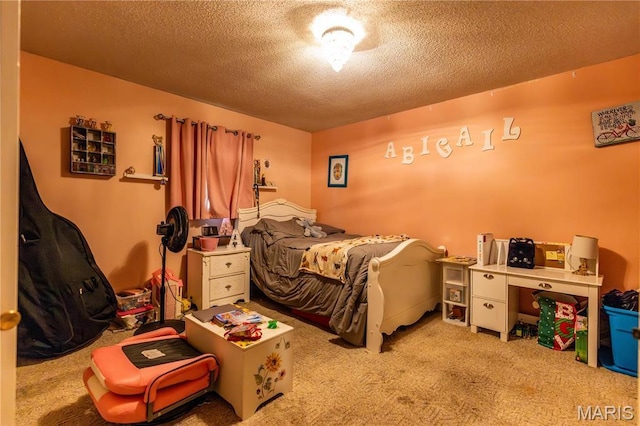 211 E Elm, Bertrand, MO 63823 - carpeted bedroom featuring a textured ceiling