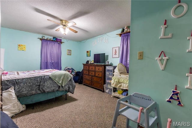 211 E Elm, Bertrand, MO 63823 - bedroom with carpet floors, a textured ceiling, and a ceiling fan