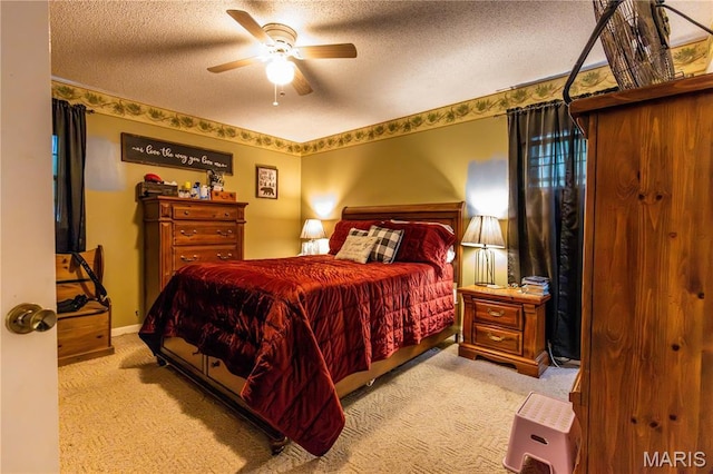 211 E Elm, Bertrand, MO 63823 - bedroom with light carpet, a textured ceiling, ceiling fan, and baseboards