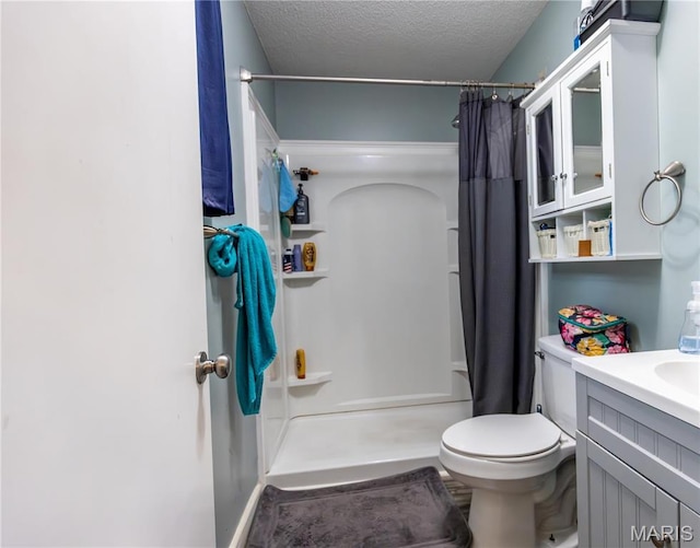 211 E Elm, Bertrand, MO 63823 - bathroom with a shower with curtain, vanity, toilet, and a textured ceiling