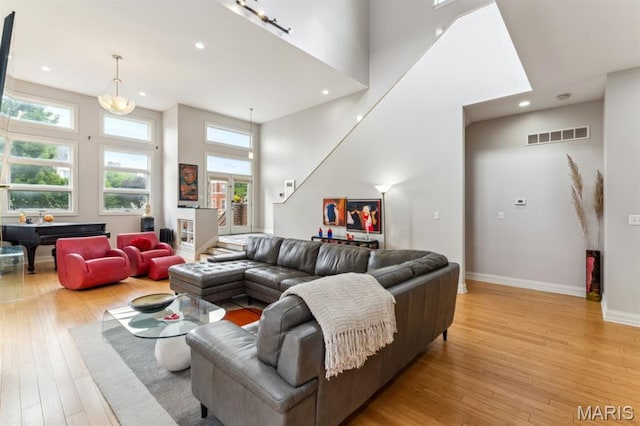 4349 Washington Blvd, Saint Louis, MO 63108 - living room with light wood-style flooring, pool table, a high ceiling, recessed lighting, and baseboards