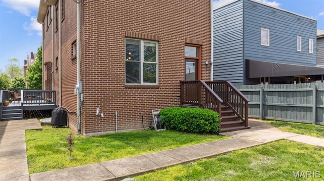 4349 Washington Blvd, Saint Louis, MO 63108 - view of front facade with brick siding and a wooden deck