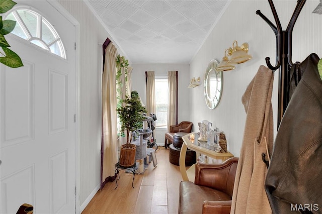 4229 Oakwood Ave, Saint Louis, MO 63121 - foyer featuring healthy amount of natural light, light wood-type flooring, crown molding, and baseboards