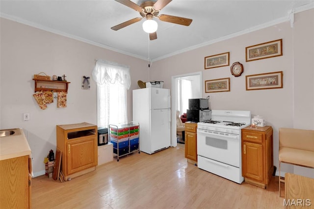 4229 Oakwood Ave, Saint Louis, MO 63121 - kitchen featuring white appliances, ornamental molding, ceiling fan, light wood-style floors, and light countertops