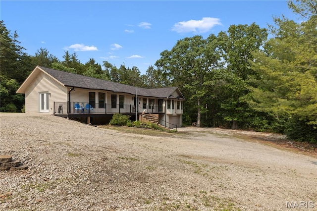 6703 Shenandoah Ln, Dittmer, MO 63023 - ranch-style home featuring dirt driveway, a garage, covered porch, and a shingled roof
