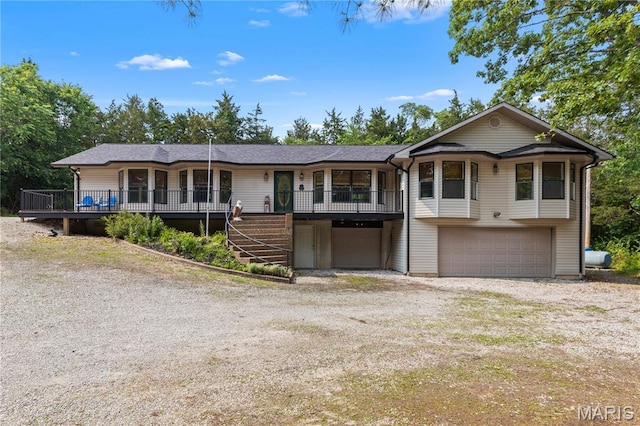 6703 Shenandoah Ln, Dittmer, MO 63023 - view of front of house with an attached garage, dirt driveway, and stairs