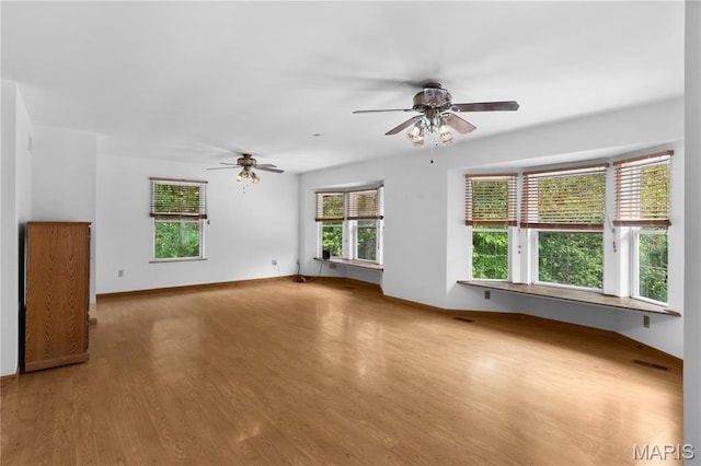 6703 Shenandoah Ln, Dittmer, MO 63023 - unfurnished living room with ceiling fan, wood finished floors, and baseboards