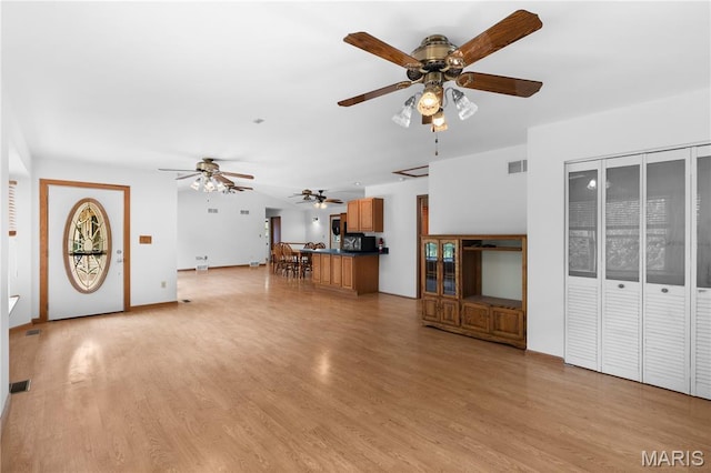 6703 Shenandoah Ln, Dittmer, MO 63023 - unfurnished living room featuring ceiling fan and light wood-type flooring