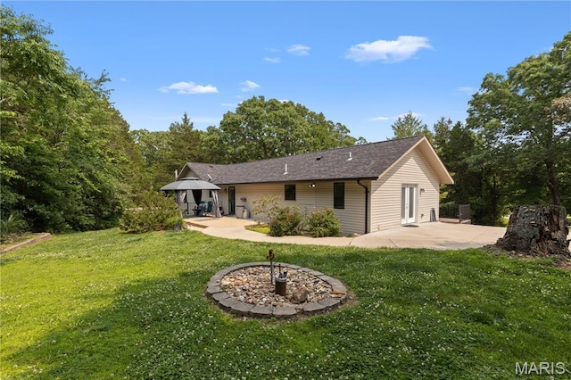 6703 Shenandoah Ln, Dittmer, MO 63023 - back of property with a patio area, a gazebo, a yard, and a shingled roof
