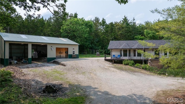 6703 Shenandoah Ln, Dittmer, MO 63023 - detached garage with a view of trees