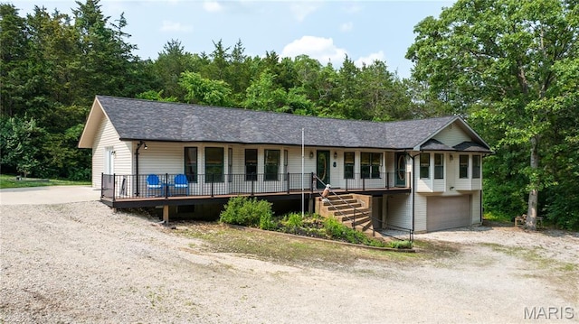 6703 Shenandoah Ln, Dittmer, MO 63023 - ranch-style house featuring a porch, an attached garage, dirt driveway, stairs, and a shingled roof