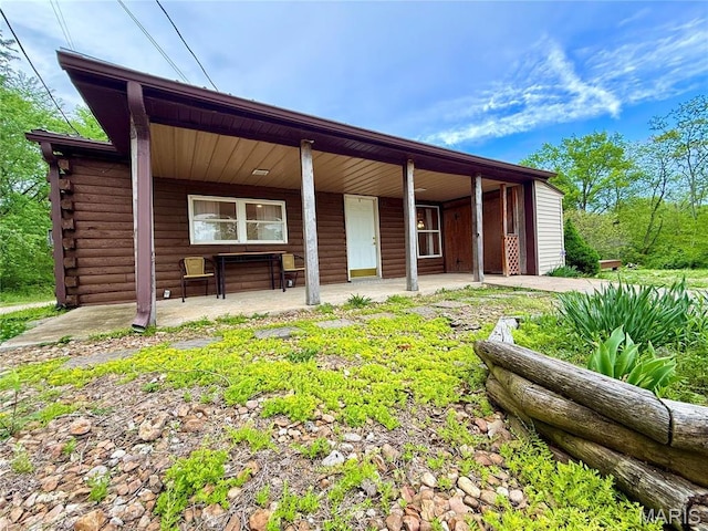1307 Pike Dr, Bismarck, MO 63624 - back of house featuring log exterior and covered porch