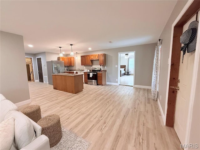 1307 Pike Dr, Bismarck, MO 63624 - living room with light wood finished floors, recessed lighting, baseboards, and ceiling fan