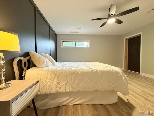 1307 Pike Dr, Bismarck, MO 63624 - bedroom featuring wood finished floors, ceiling fan, baseboards, and attic access
