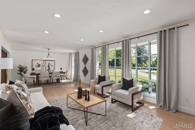 1 Woodoaks Trl, Saint Louis, MO 63124 - living room with light wood-type flooring, recessed lighting, baseboards, crown molding, and a chandelier