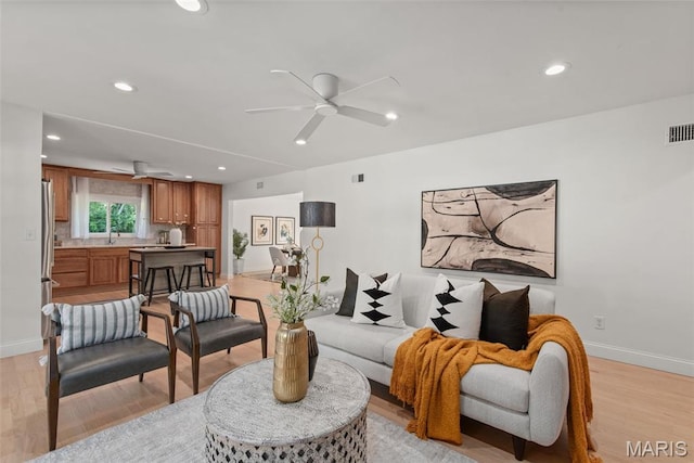 1 Woodoaks Trl, Saint Louis, MO 63124 - living room featuring light wood finished floors, baseboards, a ceiling fan, and recessed lighting