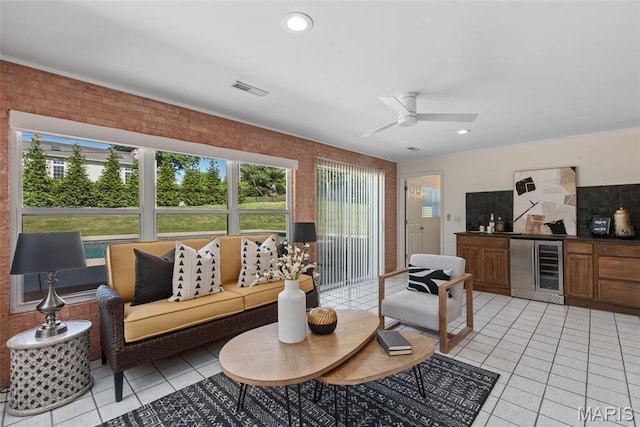 1 Woodoaks Trl, Saint Louis, MO 63124 - living area featuring beverage cooler, bar area, light tile patterned flooring, ceiling fan, and recessed lighting
