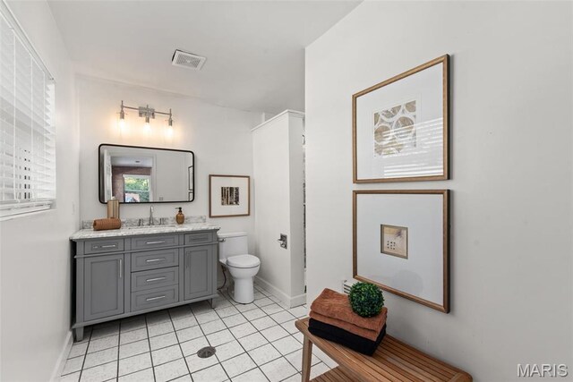 1 Woodoaks Trl, Saint Louis, MO 63124 - bathroom featuring baseboards, vanity, tile patterned floors, and toilet